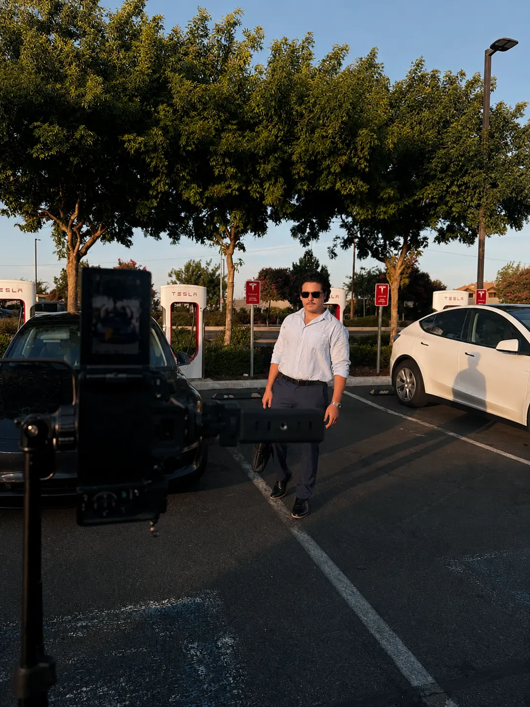 A cinema camera on a tripod set up to film on location.